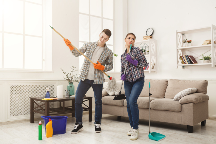 Couple cleaning at home